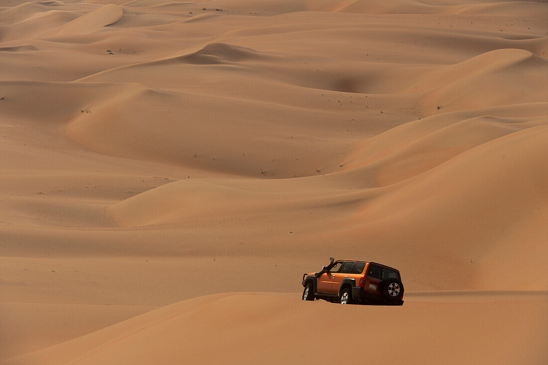 https://fasteagletravelandtoursim.com/wp-content/uploads/2025/05/13880022-UAE-Abu-Dhabi-Four-wheel-drive-going-across-sand-dunes-Liwa-1.jpg